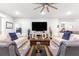 Spacious living room with plush sofas, stylish decor, and natural light creates a comfortable, inviting space at 7641 Sw 63Rd Lane Road, Ocala, FL 34474