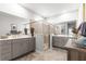Bright main bathroom featuring dual sinks, walk-in glass shower, and neutral finishes at 7641 Sw 63Rd Lane Road, Ocala, FL 34474
