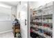 Walk-in pantry features a sliding barn door and floor-to-ceiling wire shelving for ample storage at 7641 Sw 63Rd Lane Road, Ocala, FL 34474
