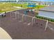 Aerial view of the playground featuring swings, slides, and ample space for activities at 7641 Sw 63Rd Lane Road, Ocala, FL 34474