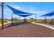 Community playground with slides, swings, and covered play areas offers fun for families at 7641 Sw 63Rd Lane Road, Ocala, FL 34474