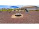 Community playground featuring a merry-go-round and slide with protective ground cover at 7641 Sw 63Rd Lane Road, Ocala, FL 34474