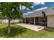A spacious backyard features a covered patio, a basketball hoop and lush greenery at 8170 Sw 56Th Avenue Rd, Ocala, FL 34476