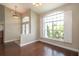 Sun-filled dining room with a large window and views of the landscaped yard at 8170 Sw 56Th Avenue Rd, Ocala, FL 34476