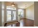 Inviting foyer with hardwood floors, transom windows, and elegant lighting at 8170 Sw 56Th Avenue Rd, Ocala, FL 34476