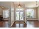 Open foyer featuring hardwood floors, transom windows, and neutral paint at 8170 Sw 56Th Avenue Rd, Ocala, FL 34476