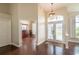 Warm and inviting foyer with hardwood floors and transom windows at 8170 Sw 56Th Avenue Rd, Ocala, FL 34476