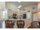 Spacious kitchen features an island with bar stool seating and modern appliances at 8170 Sw 56Th Avenue Rd, Ocala, FL 34476