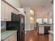 Open concept kitchen features modern appliances and flows into the dining area at 8170 Sw 56Th Avenue Rd, Ocala, FL 34476
