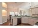 Bright kitchen features wooden floors, modern appliances, and an eat-in dining area at 8170 Sw 56Th Avenue Rd, Ocala, FL 34476