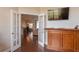 Open living room with access to the dining area and a mounted television at 8170 Sw 56Th Avenue Rd, Ocala, FL 34476