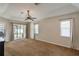Spacious carpeted main bedroom with windows and sliding glass door at 8170 Sw 56Th Avenue Rd, Ocala, FL 34476