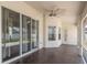 Covered patio featuring tile flooring, a ceiling fan, and sliding glass doors at 8170 Sw 56Th Avenue Rd, Ocala, FL 34476