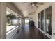 Covered patio featuring tile flooring, multiple ceiling fans, and sliding glass doors at 8170 Sw 56Th Avenue Rd, Ocala, FL 34476