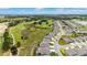 Aerial view showcasing the golf course community layout with well-placed homes, green spaces, and scenic views at 8606 Sw 61St Loop, Ocala, FL 34481