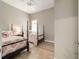 Coastal style bedroom with two twin beds, coral bedding, and neutral walls at 8606 Sw 61St Loop, Ocala, FL 34481