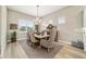 Dining room with chandelier, large windows and seating for six at 8606 Sw 61St Loop, Ocala, FL 34481
