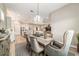 Dining room features a chandelier with easy access to the kitchen and living spaces at 8606 Sw 61St Loop, Ocala, FL 34481
