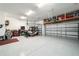 Epoxy floor garage with storage. Contains overhead storage and a golf cart at 8606 Sw 61St Loop, Ocala, FL 34481