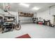 Spacious garage with epoxy floors, overhead storage, and ample room for parking and hobbies at 8606 Sw 61St Loop, Ocala, FL 34481