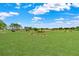 Scenic view of the lush golf course, featuring well-manicured greens and a picturesque landscape under a bright blue sky at 8606 Sw 61St Loop, Ocala, FL 34481
