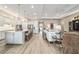 Bright open-concept living room boasts tile flooring and a gourmet kitchen at 8606 Sw 61St Loop, Ocala, FL 34481