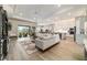 Open-concept living area features tile flooring, a ceiling fan, and great natural light at 8606 Sw 61St Loop, Ocala, FL 34481