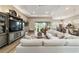 Spacious living room featuring a modern ceiling fan and glass patio doors at 8606 Sw 61St Loop, Ocala, FL 34481