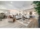 Bright and spacious living room featuring a tray ceiling and open layout at 8606 Sw 61St Loop, Ocala, FL 34481