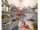 Walk-in pantry with abundant shelving for storage of food and household goods at 8606 Sw 61St Loop, Ocala, FL 34481