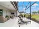 Relaxing outdoor space with comfortable seating, ceiling fan, and views of lush greenery at 8606 Sw 61St Loop, Ocala, FL 34481