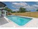 Stunning backyard with a refreshing pool, lounge chairs, and a privacy fence at 8622 Baylor Cir, Orlando, FL 32817