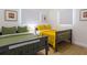 Spacious bedroom with two beds, light-colored wood floor, and modern decor at 8622 Baylor Cir, Orlando, FL 32817