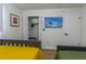 Bedroom with two beds and a TV, closet, and a light-colored wood floor at 8622 Baylor Cir, Orlando, FL 32817
