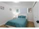 Bright bedroom features a comfortable bed, closet, and natural light from the window at 8622 Baylor Cir, Orlando, FL 32817