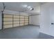 Spacious two-car garage with ample room for parking and storage, featuring a clean and modern interior at 8622 Baylor Cir, Orlando, FL 32817