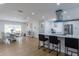 Open-concept kitchen and dining area with sleek appliances, island seating, and modern décor at 8622 Baylor Cir, Orlando, FL 32817