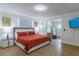 Bright bedroom featuring a contemporary bed, modern furnishings, and neutral decor at 8622 Baylor Cir, Orlando, FL 32817