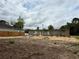 Construction site showing the block frame of a house under construction with sand and partial clearing of the lot at 8664 Se 162Nd St, Summerfield, FL 34491