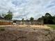 A construction site shows the beginning stages of a home build with a concrete foundation and block walls at 8664 Se 162Nd St, Summerfield, FL 34491