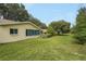 Expansive backyard with well-maintained lawn and view of the screened-in lanai at 8784 Sw 93Rd Ln # A, Ocala, FL 34481