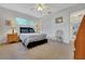 Bedroom featuring carpet, a ceiling fan, closet, and natural light from a window at 8784 Sw 93Rd Ln # A, Ocala, FL 34481