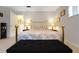 Bedroom featuring a gold headboard, bedside lamps, and neutral carpet at 8784 Sw 93Rd Ln # A, Ocala, FL 34481