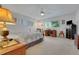 Spacious bedroom with large windows, a ceiling fan and carpet flooring at 8784 Sw 93Rd Ln # A, Ocala, FL 34481