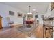 Dining area with a round table, ornate chairs, and a decorative rug over wood flooring at 8784 Sw 93Rd Ln # A, Ocala, FL 34481