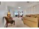 Bright living room with comfortable seating, soft lighting, and carpet flooring for a cozy feel at 8784 Sw 93Rd Ln # A, Ocala, FL 34481