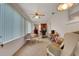 Bright sunroom with large windows, a ceiling fan, and casual seating and work space at 8784 Sw 93Rd Ln # A, Ocala, FL 34481