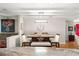 Dining room features a table with bench seating, stylish lighting, and a red door leading outside at 8874 Sw 95Th St # E, Ocala, FL 34481