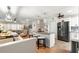 Open kitchen features granite counters, pendant lighting, and stainless steel appliances at 8874 Sw 95Th St # E, Ocala, FL 34481