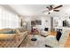Bright living room featuring stylish decor, natural light, and wood-look flooring at 8874 Sw 95Th St # E, Ocala, FL 34481